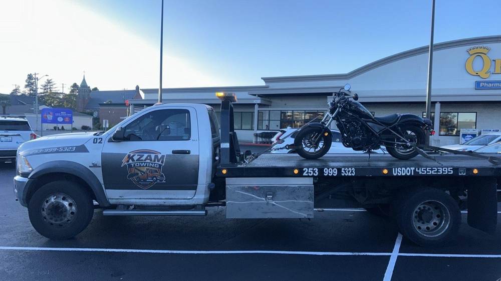 KZAM towing a pickup truck